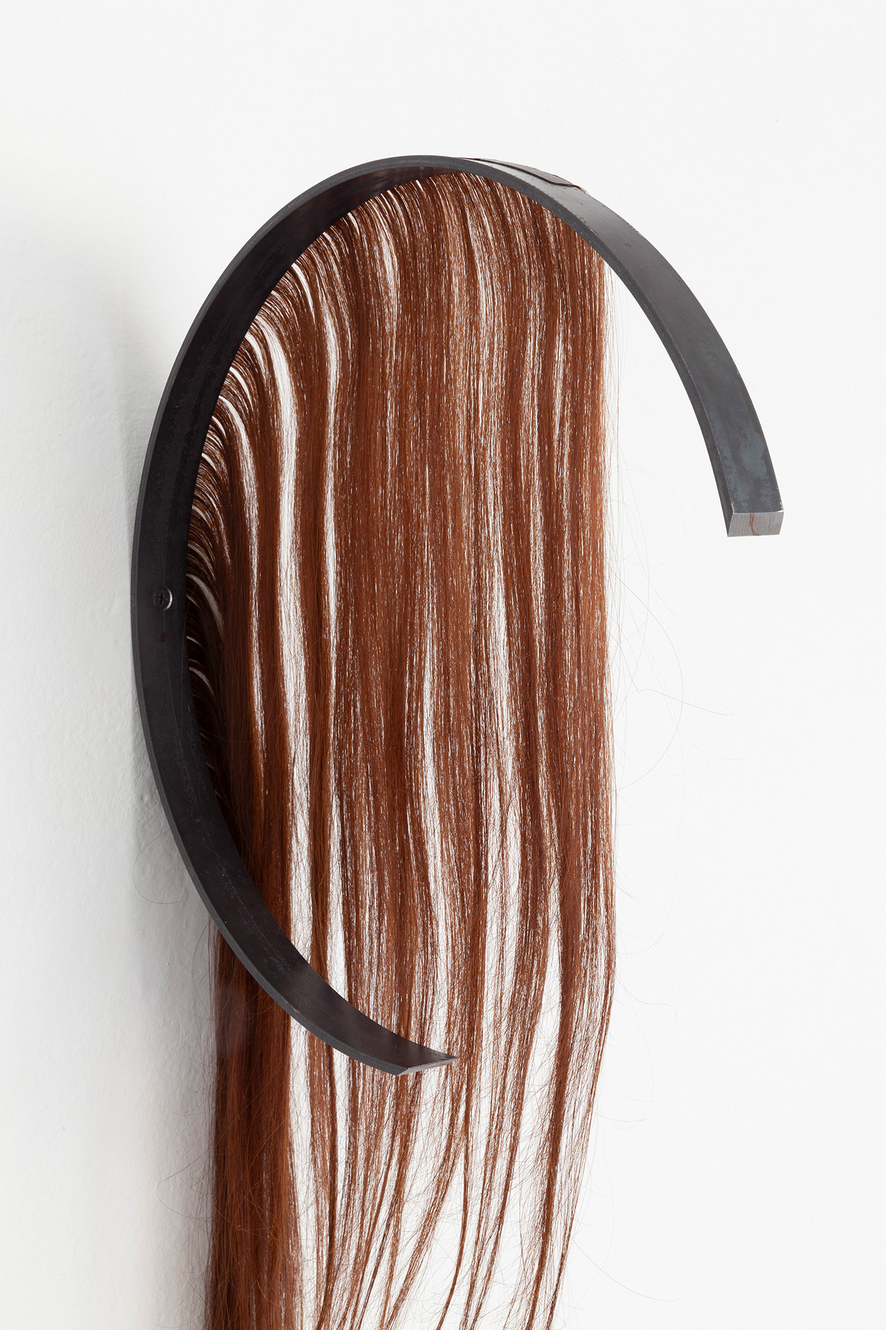 Close up. The Mess we're In I 2024 hairextension (real hair) and iron 74x33x6 cm